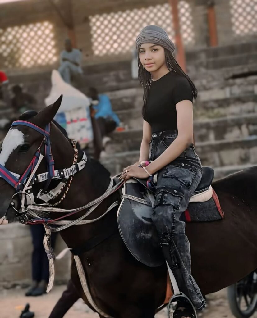 Photo of Amani ridding a Horse